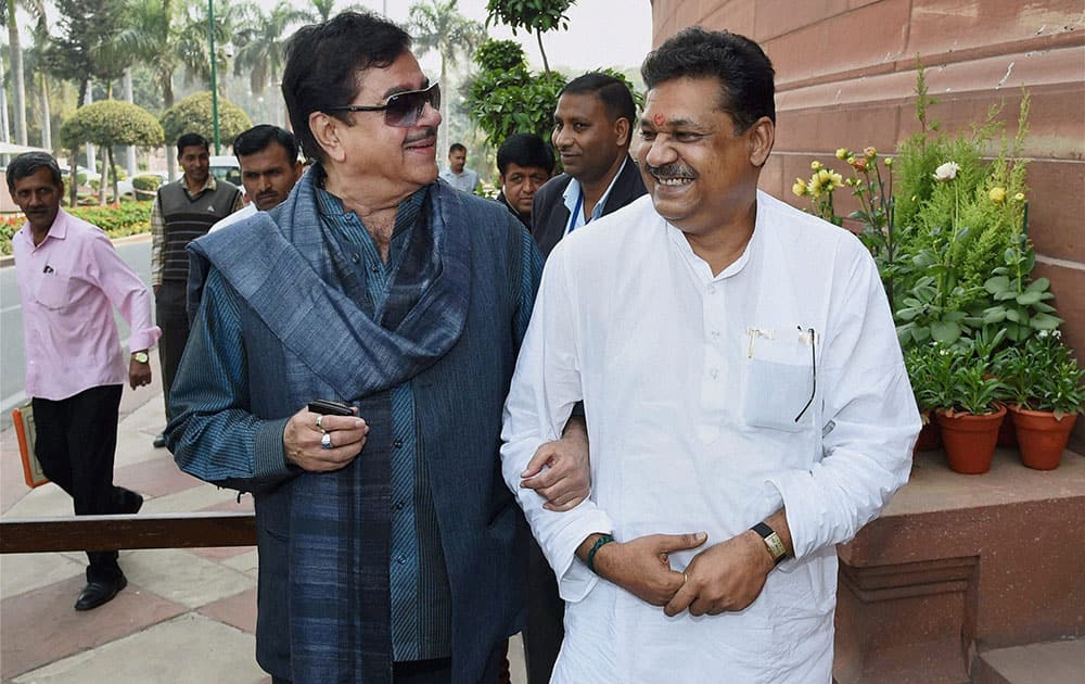 BJP MPs Shatrughan Sinha and Kirti Azad outside Parliament during the budget session.