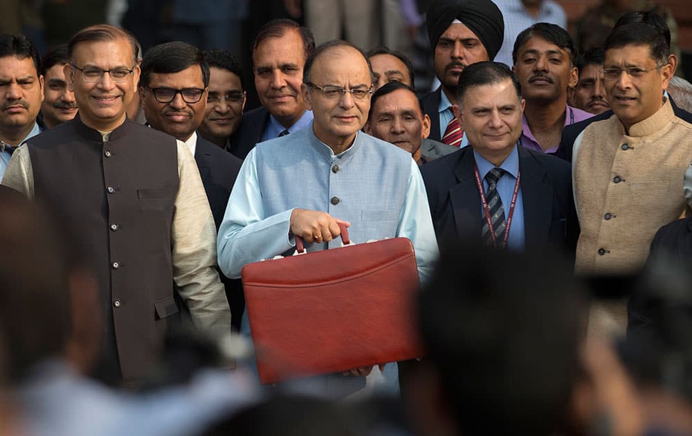 Indian Finance Minister Arun Jaitley, center, leaves for annual budget presentation at parliament in New Delhi, India.