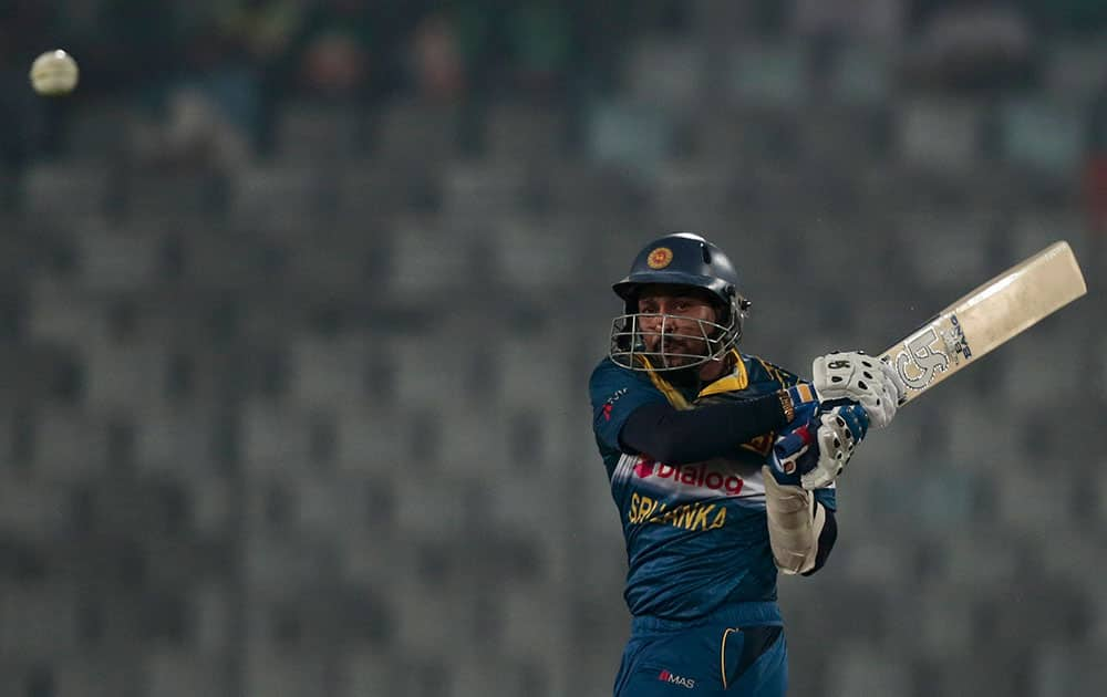 Sri Lanka’s Tillakaratne Dilshan plays a shot during the Asia Cup Twenty20 international cricket match against India in Dhaka, Bangladesh.