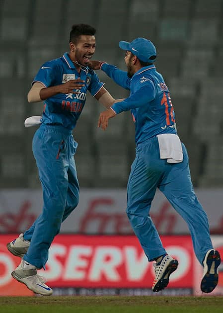 Hardik Pandya celebrates with his teammate Virat Kohli the dismissal of Sri Lanka’s Tillakaratne Dilshan duringtheir Asia Cup Twenty20 international cricket match in Dhaka, Bangladesh.