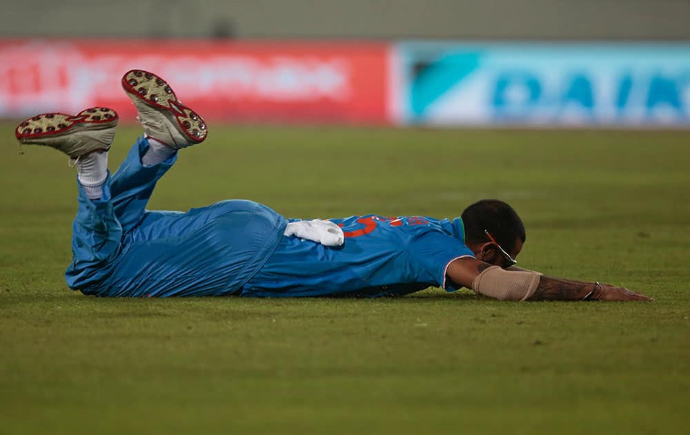 Shikhar Dhawan dives to stop the ball during the Asia Cup Twenty20 international cricket match against Sri Lanka in Dhaka, Bangladesh.