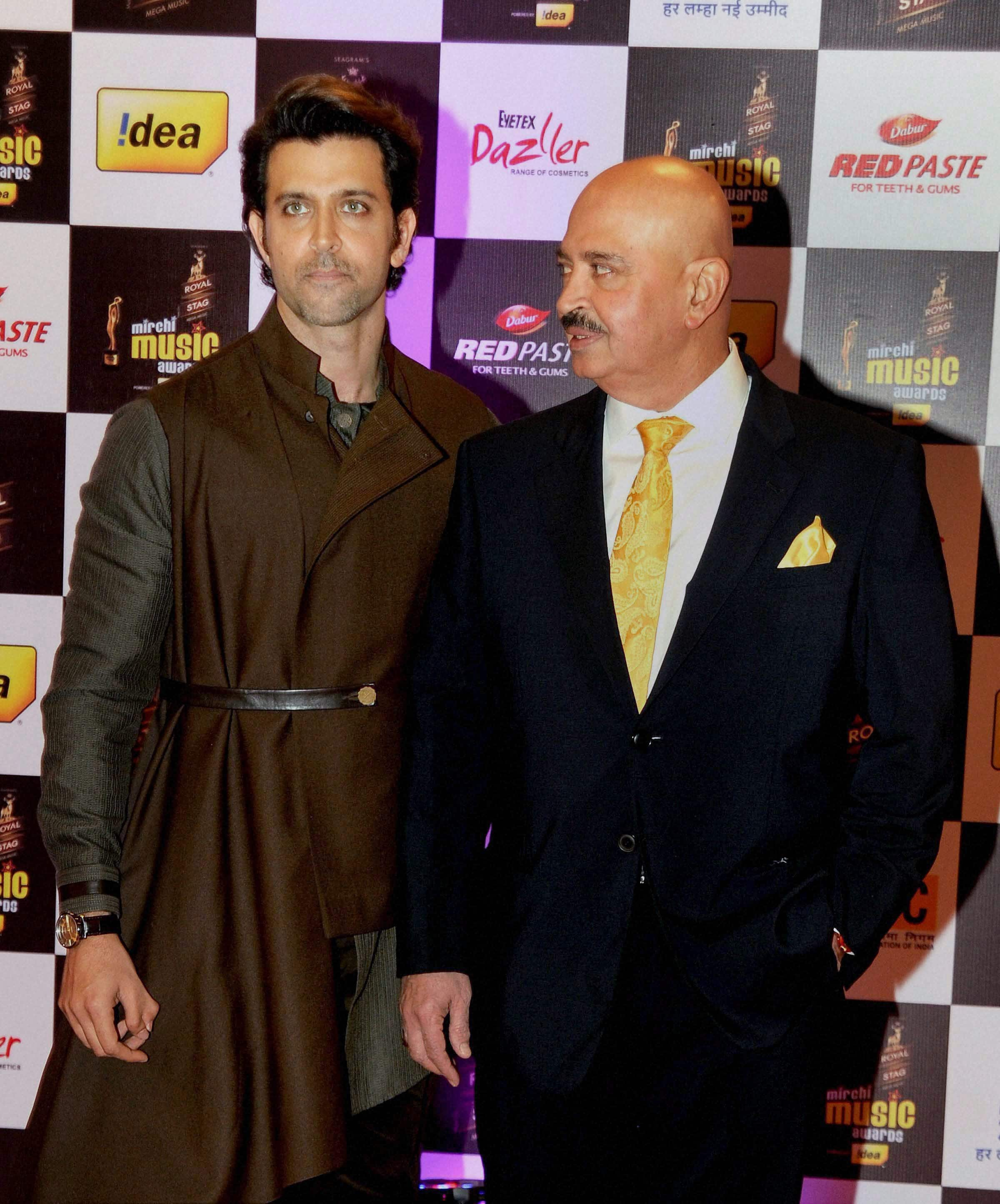 Actor Hrithik Roshan with his father and actor Rakesh Roshan at the 8th Mirchi Music Awards in Mumbai.