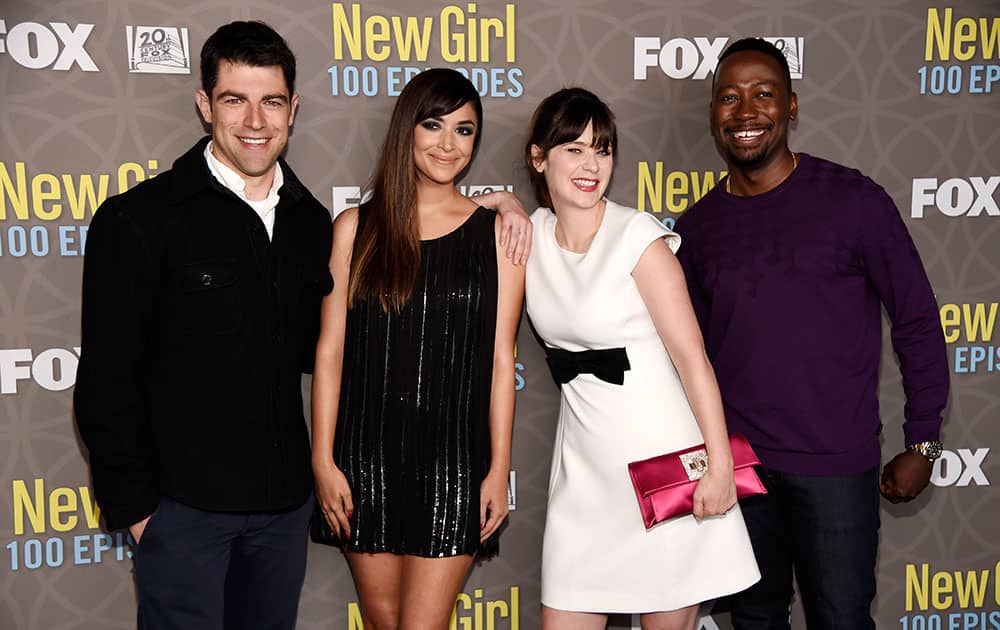 Max Greenfield, from left, Hannah Simone, Zooey Deschanel and Lamorne Morris, cast members in 'The New Girl,' pose together at a party celebrating the 100th episode of the television series at the W Hotel Westwood.