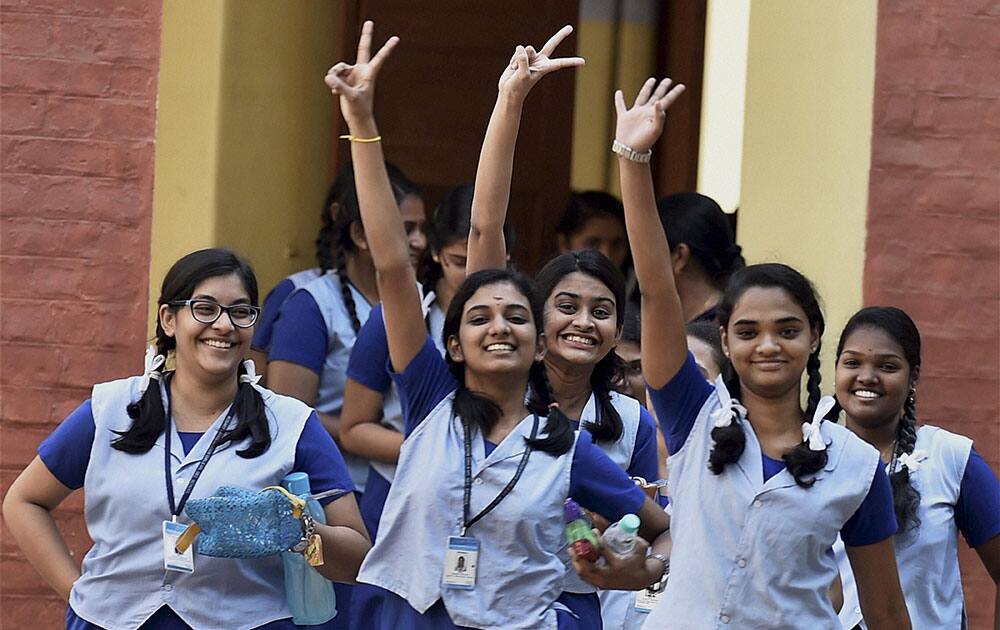 Students of Class 12th jubilate at an examination centre after appearing in board examinations in Chennai.