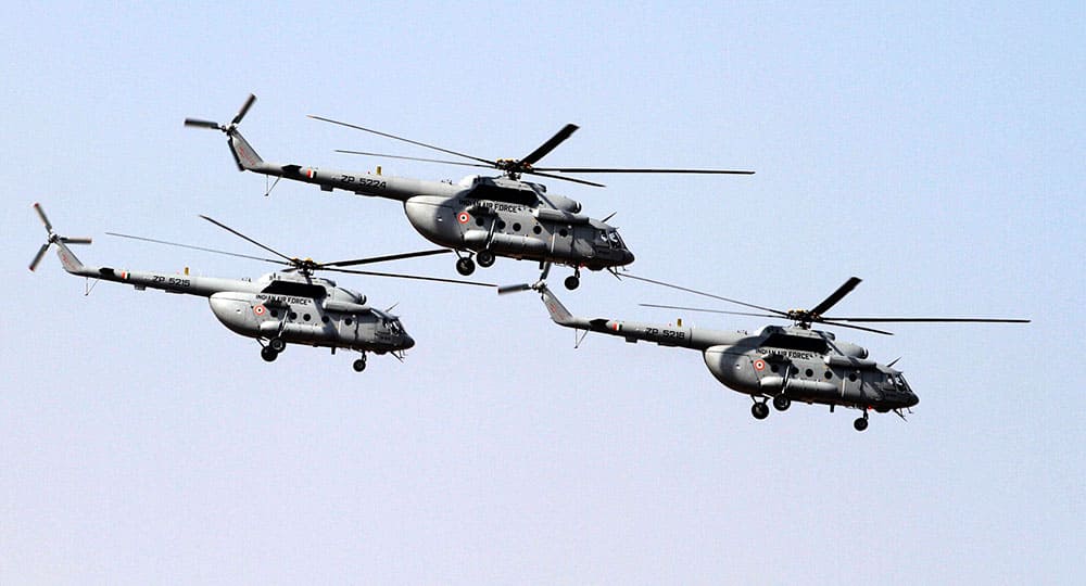 Indian Air Force's Mi- 17 V5 helicopters fly-past during President's standard and colour presentation at Air Force station in Jamnagar.