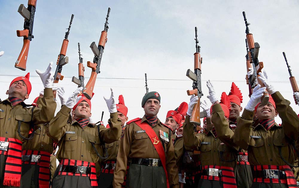 Army recruits celebrate after passing out parade at Jammu and Kashmir Light Infantry Regimental Centre, in Srinagar.