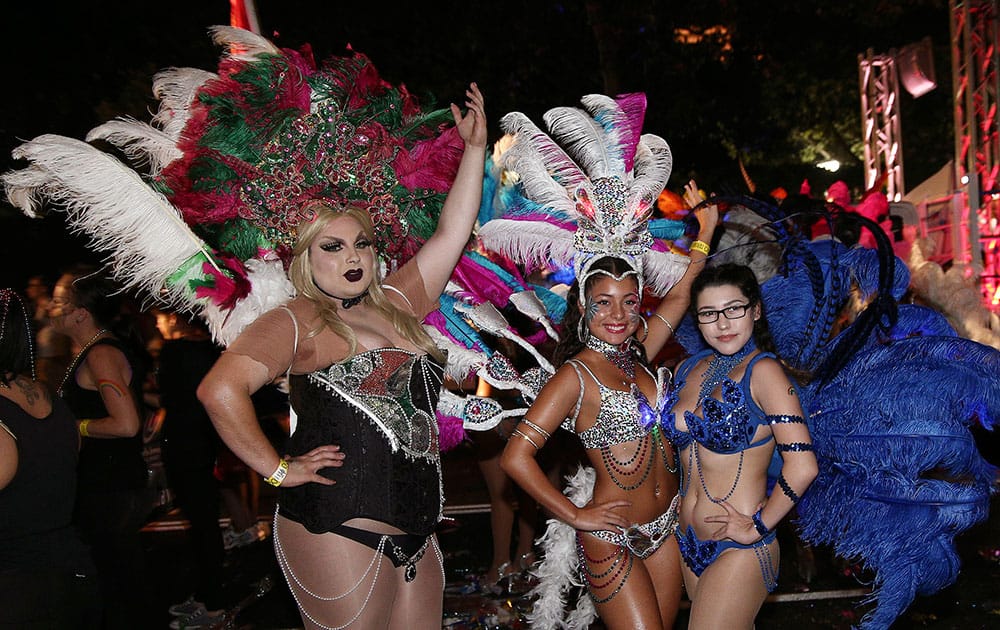 Participants pose for a photo as they march along a street during the 38th annual Gay and Lesbian Mardi Gras in Sydney.