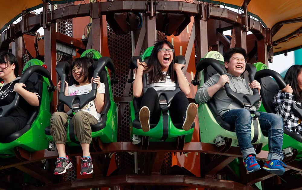 People ride an attraction at Taipei Amusement Park in Taipei, Taiwan.