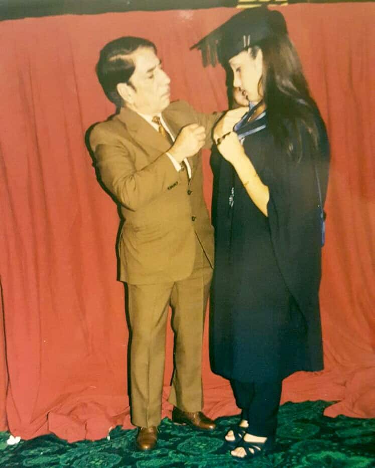Sofia Hayat :-My daddy helping me adjust my graduation gown. Miss you and love you. You said. 