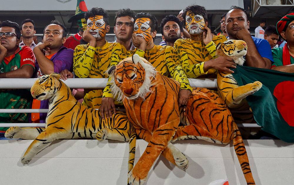 Bangladeshi spectators watch after India won the Asia Cup Twenty20 international cricket final match against Bangladesh in Dhaka, Bangladesh.