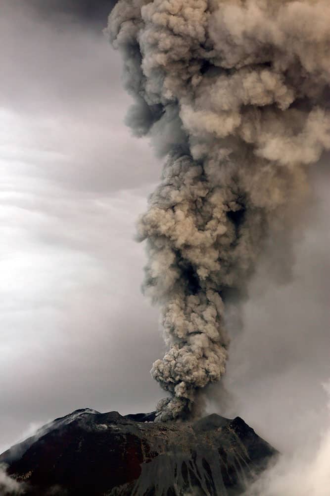 The Tungurahua volcano spews a column of ash during an eruption seen from Huambalo, Ecuador.