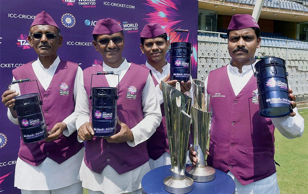 Mumbai Dabbawalas pose for a photo during a promotional event ahead of the ICC WT20 in Mumbai.