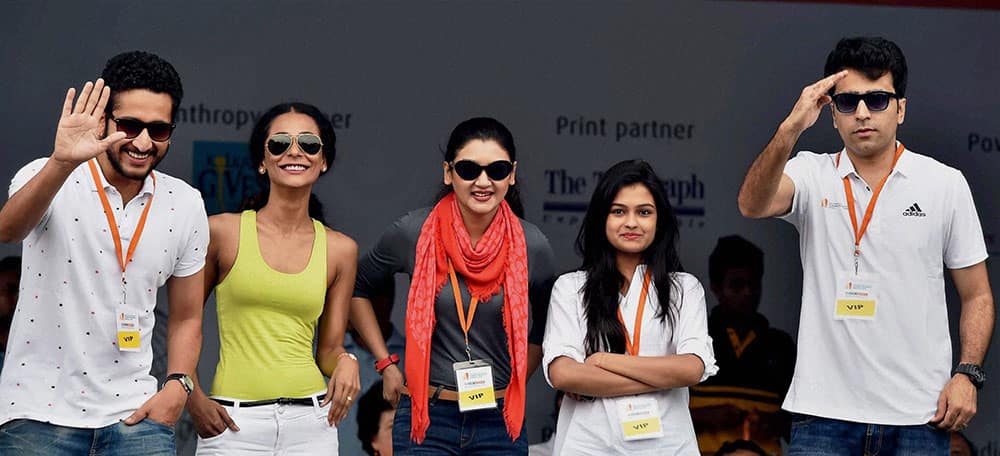 Tollywood actresses encourage the runners during Kolkata Marathon in Kolkata.