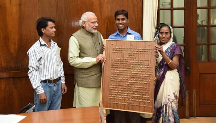 Kanpur man Sandeep Soni carves Gita on wood, gifts it to PM Narendra Modi; picture goes viral!