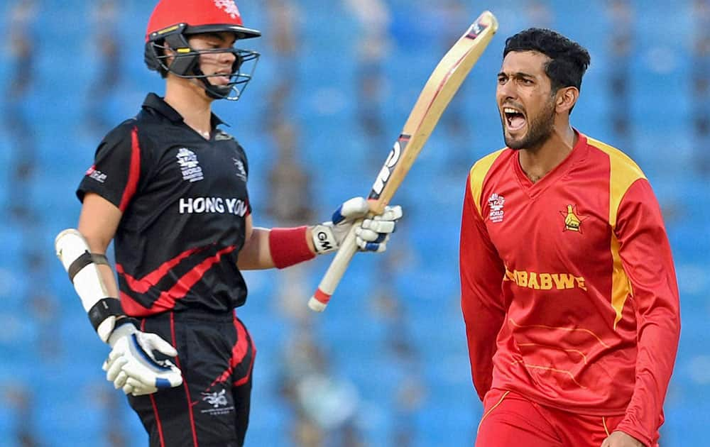 Zimbabwe bowler Sikandar Raza celebrates the wicket of Hong Kong batsman Mark Chapman during the ICC World Twenty20 2016 cricket tournament at the Vidarbha Cricket Association Stadium in Nagpur.