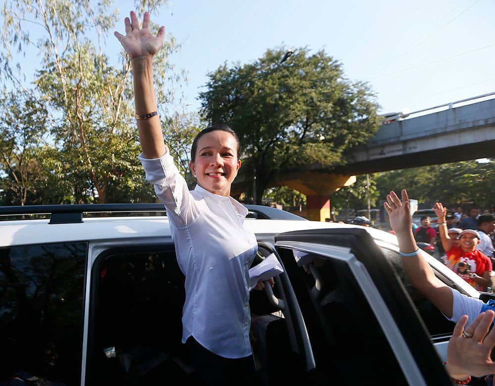 Philippine presidential candidate Sen. Grace Poe waves to supporters after addressing a rally to mark International Womens Day.