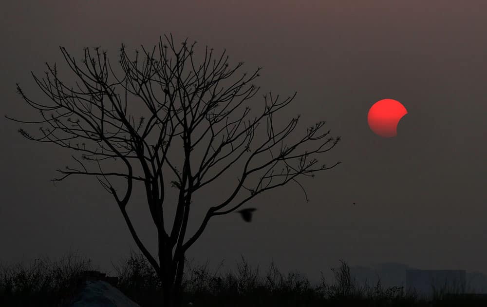 A partial solar eclipse is seen from Dhaka, Bangladesh.