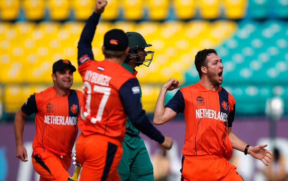 Paul van Meekeren of the Netherlands celebrates the dismissal of Bangladesh's Soumya Sarkar during the ICC World Twenty20 2016 cricket tournament at the Himachal Pradesh Cricket Association (HPCA) stadium in Dharmsala.