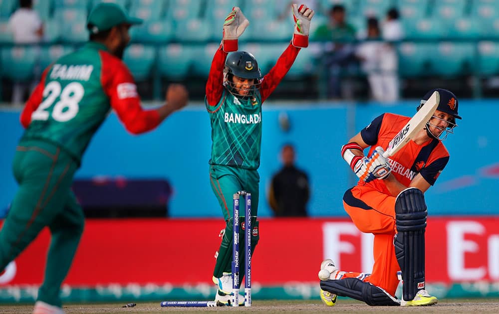 Netherlands' Ben Cooper, is bowled by Bangladesh's Shakib Al Hasan during the ICC World Twenty20 2016 cricket tournament at the Himachal Pradesh Cricket Association (HPCA) stadium in Dharmsala.