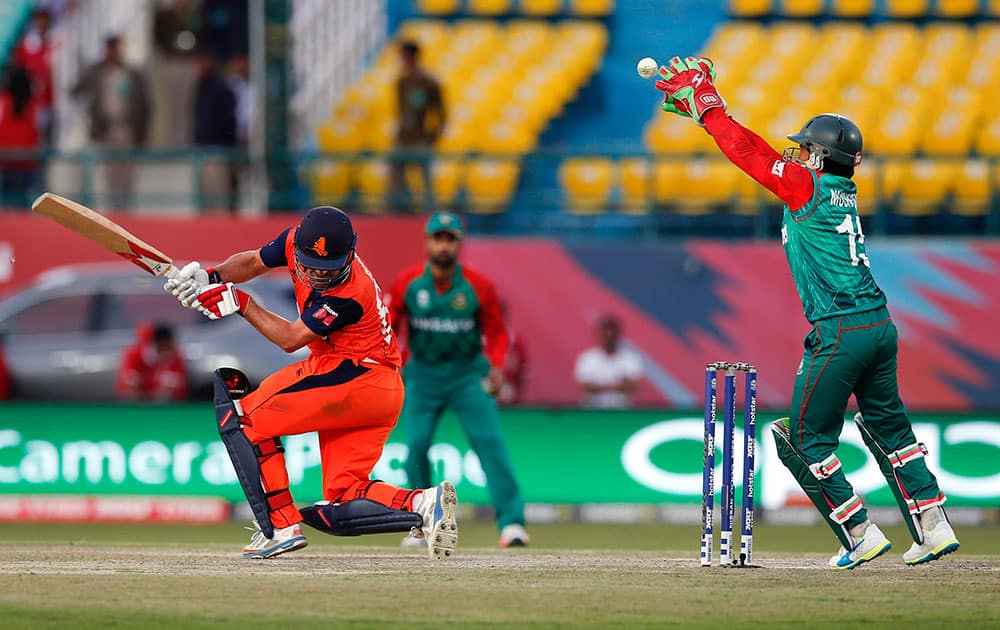 Bangladesh's Mustafizur Rahman tries to field a ball from Peter Borren of the Netherlands during the ICC World Twenty20 2016 cricket tournament at the Himachal Pradesh Cricket Association (HPCA) stadium in Dharmsala.