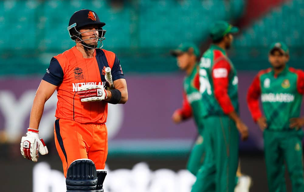 Roelof van der Merwe of the Netherlands walks back after his dismissal during the ICC World Twenty20 2016 cricket tournament against Bangladesh at the Himachal Pradesh Cricket Association (HPCA) stadium in Dharmsala.