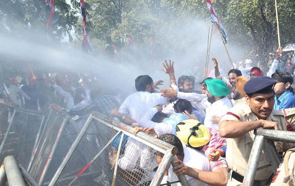 Police uses water cannons to disperse Youth Congress activists during a protest in Chandigarh.