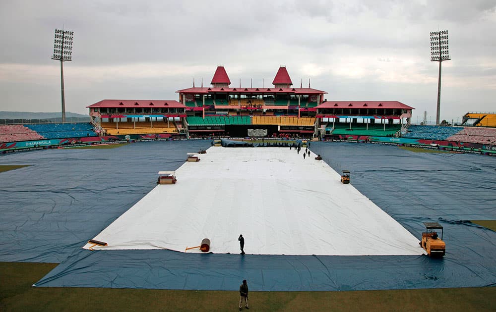 Covers protect the field after morning showers at the Himachal Pradesh Cricket Association (HPCA) stadium ahead of the Netherlands match against Oman at the ICC World Twenty20 2016 cricket tournament in Dharmsala.