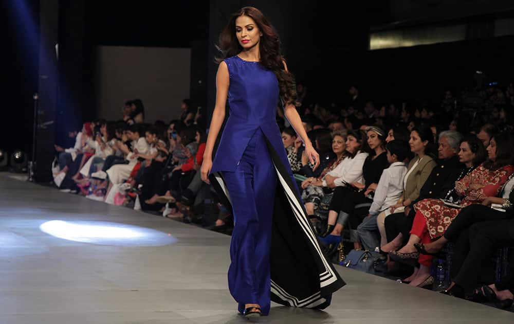 A model presents creation by designer Sania Maskatiya during Fashion Week by the Pakistan Fashion Design Council in Lahore, Pakistan.