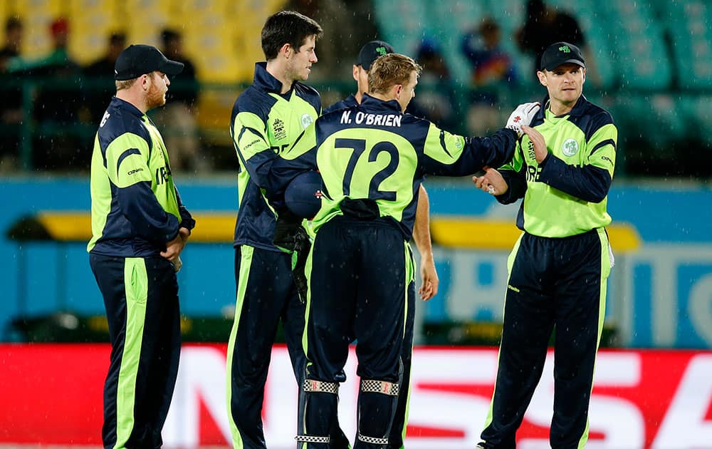 Ireland player's celebrate the dismissal of Bangladesh's Tamim Iqbal during their match at the ICC World Twenty20 2016 cricket tournament at the Himachal Pradesh Cricket Association (HPCA) stadium in Dharmsala.