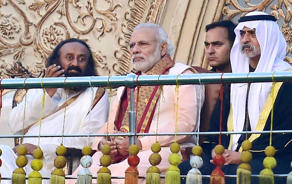 Prime Minister Narendra Modi with Art of Living founder Sri Sri Ravishankar during the opening day of the three-day long World Culture Festival on the banks of Yamuna River in New Delhi.