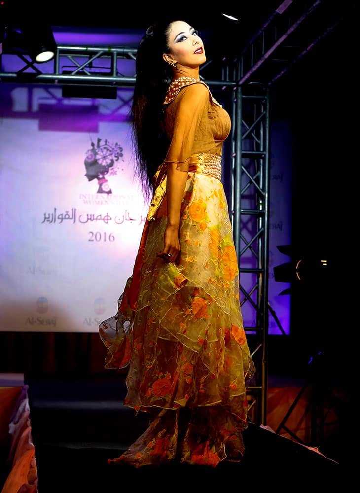 A model presents a creation by Iraqi designer Zead al-Athary during a fashion show at Basra International Hotel in Basra, 340 miles (550 kilometers) southeast of Baghdad, Iraq.