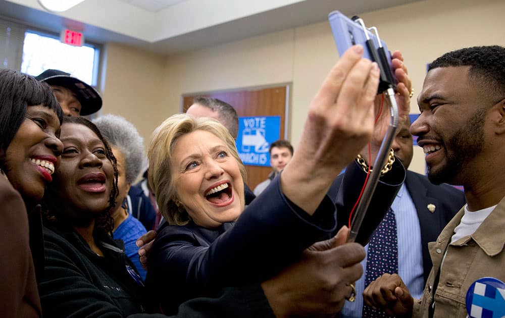 Democratic presidential candidate Hillary Clinton poses for photos with supporters after speaking at the the OFallon Park Recreation Complex in St. Louis.
