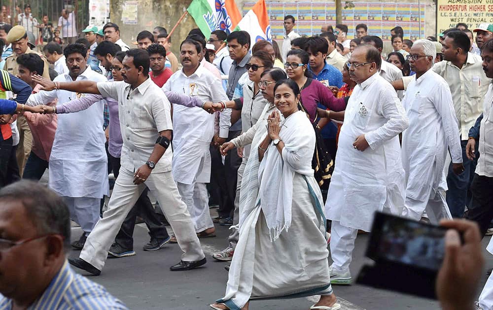 West Bengal Chief Minister and TMC Supremo Mamata Banerjee participates in a roadshow as a part of her election campaign in Kolkata on Saturday ahead of the State Assembly elections.