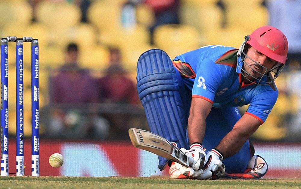 Afghanistan batsman Samiullah Shenwari plays a shot during the ICC World Twenty20 2016 cricket tournament against Zimbabwe in Nagpur.