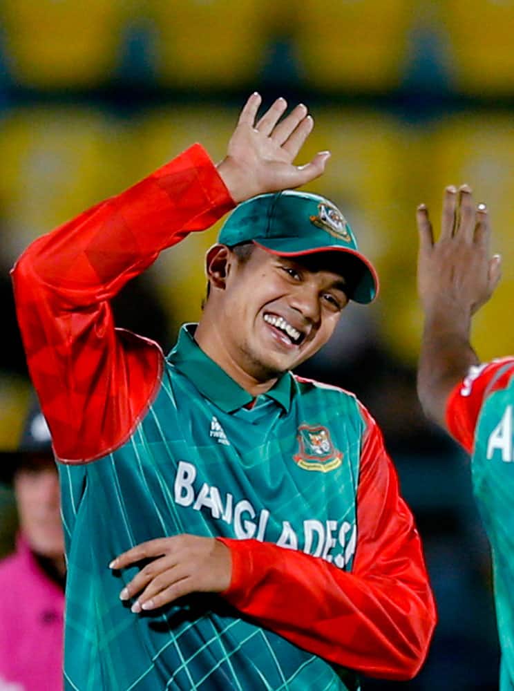 Bangladesh's Taskin Ahmed, celebrates a wicket during the ICC World Twenty20 2016 cricket tournament against Oman at the Himachal Pradesh Cricket Association (HPCA) stadium in Dharamsala.