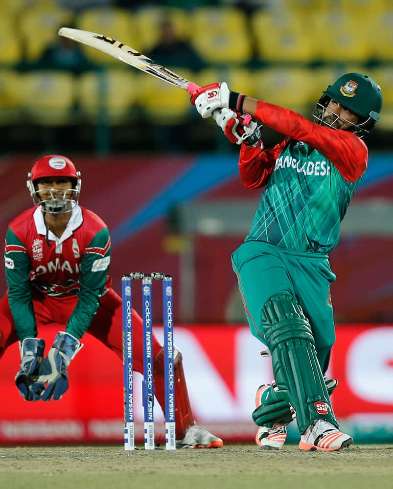 Bangladesh's Tamim Iqbal bats during the ICC World Twenty20 2016 cricket tournament against Oman at the Himachal Pradesh Cricket Association (HPCA) stadium in Dharamsala.