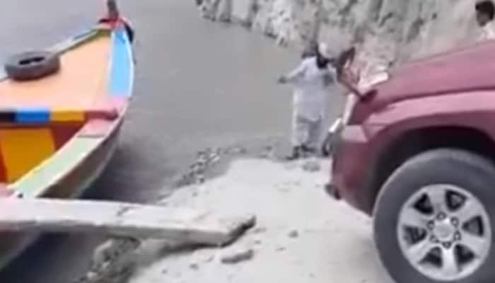Watch: Only in Pakistan – Mitsubishi Prado cruises on a boat!