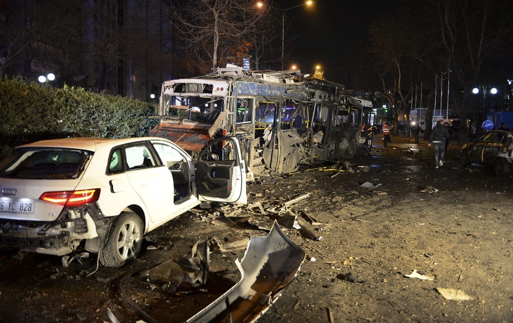 Damaged vehicles are seen at the scene of an explosion in Ankara. The explosion is believed to have been caused by a car bomb that went off close to bus stops.
