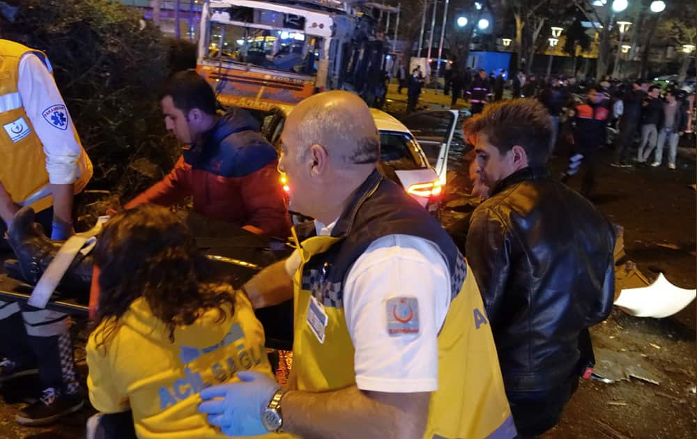 Medics carry an injured person at the explosion site in the busy center of Turkish capital, Ankara.