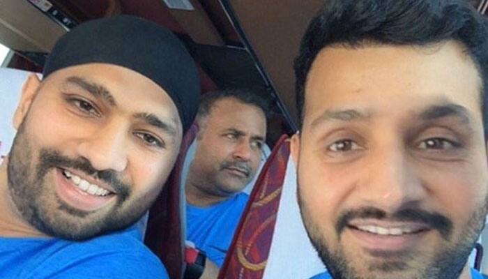 PHOTO: Who is this India cricketer sitting next to Rohit Sharma in the team bus?