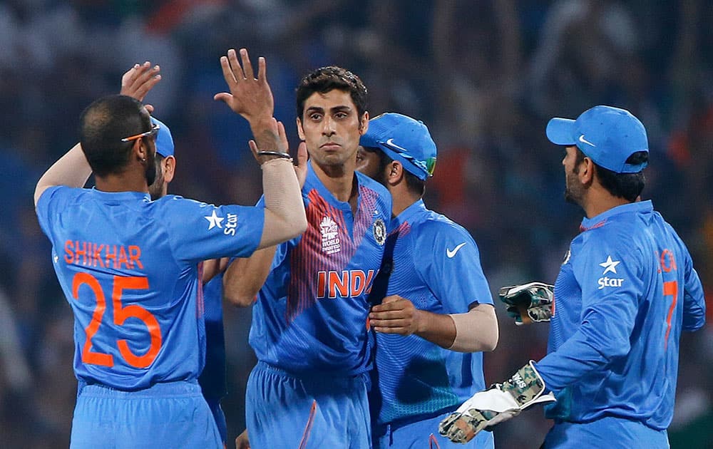 Ashish Nehra celebrates the wicket of New Zealand's Adam Milne Colin Munro during the ICC World Twenty20 2016 cricket match at the Vidarbha Cricket Association stadium in Nagpur.