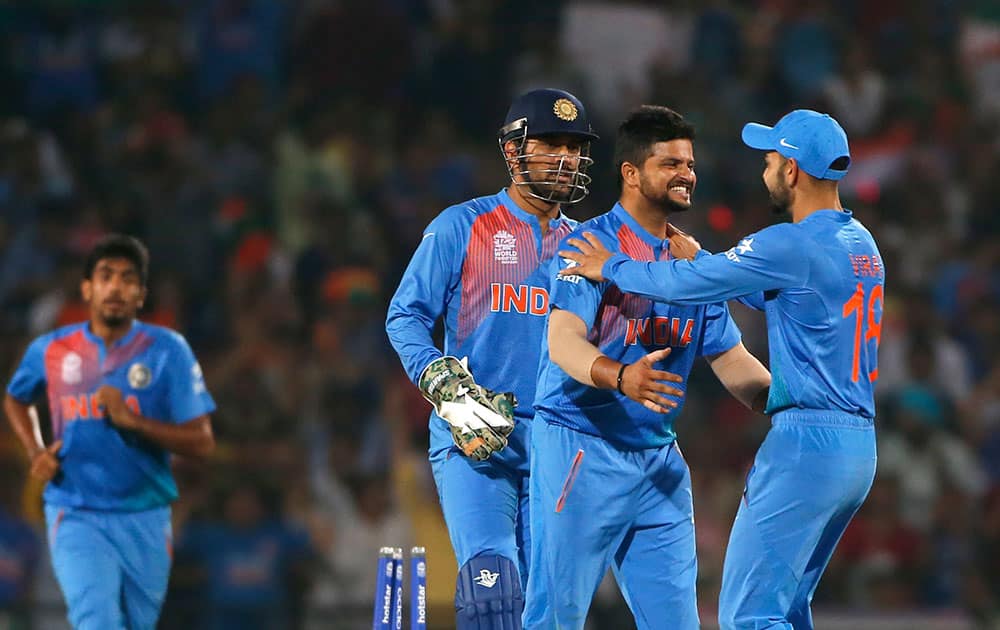 Suresh Raina celebrates the wicket of New Zealand's Kane Williamson during the ICC World Twenty20 2016 cricket match at the Vidarbha Cricket Association stadium in Nagpur.