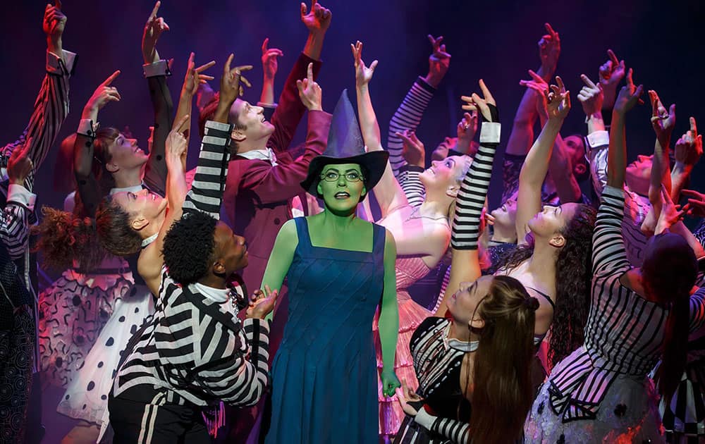 In this undated image provided by Polk and Co, performers appear in Wicked in New York. 