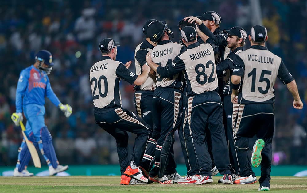 New Zealand players celebrate the wicket of India's Ravindra Jadeja during the ICC World Twenty20 2016 cricket match at the Vidarbha Cricket Association stadium in Nagpur.