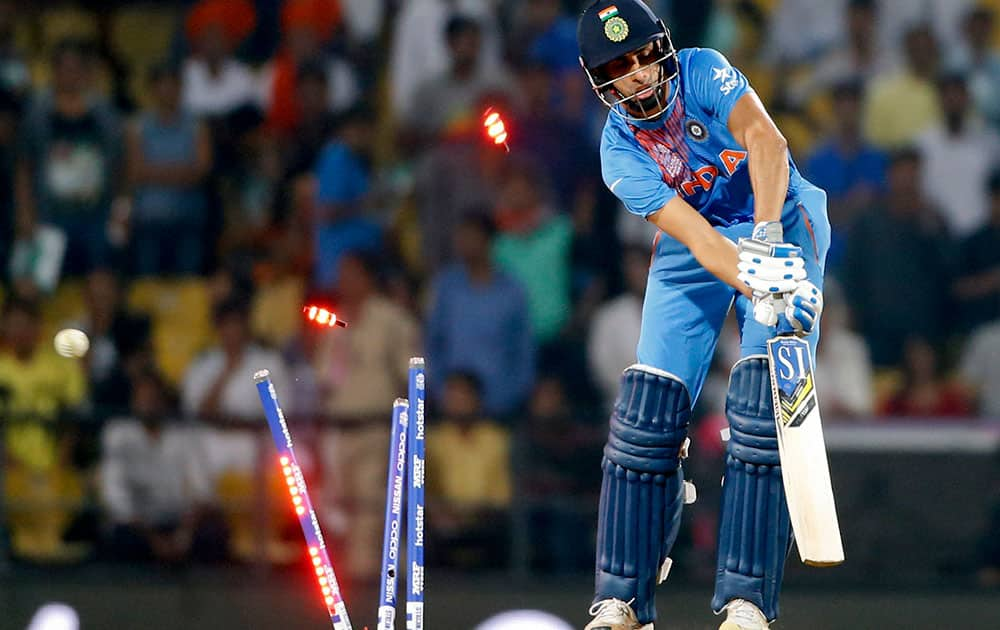 Ashish Nehra is bowled during the ICC World Twenty20 2016 cricket match against New Zealand at the Vidarbha Cricket Association stadium in Nagpur.