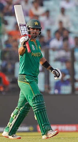 Pakistan's Ahmed Shehzad acknowledges scoring fifty runs during their match against Bangladesh in the ICC World Twenty20 2016 cricket in Kolkata.