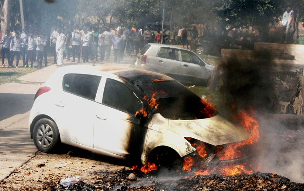 A car catches fire in Faridabad.