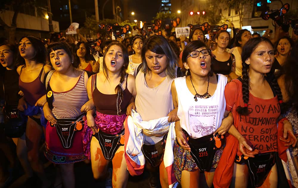 Demonstrators representing female victims of forced sterilizations during Alberto Fujimori's government protest the presidential candidacy of his daughter Keiko Fujimori at Plaza San Martin in downtown Lima, Peru.