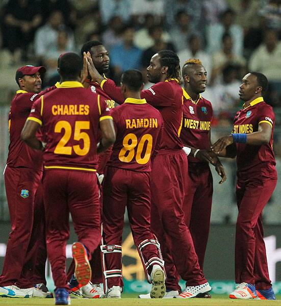 West indies players celebrate the wicket of England's Jason Roy during their ICC World Twenty20 2016 cricket match at the Wankhede stadium in Mumbai.