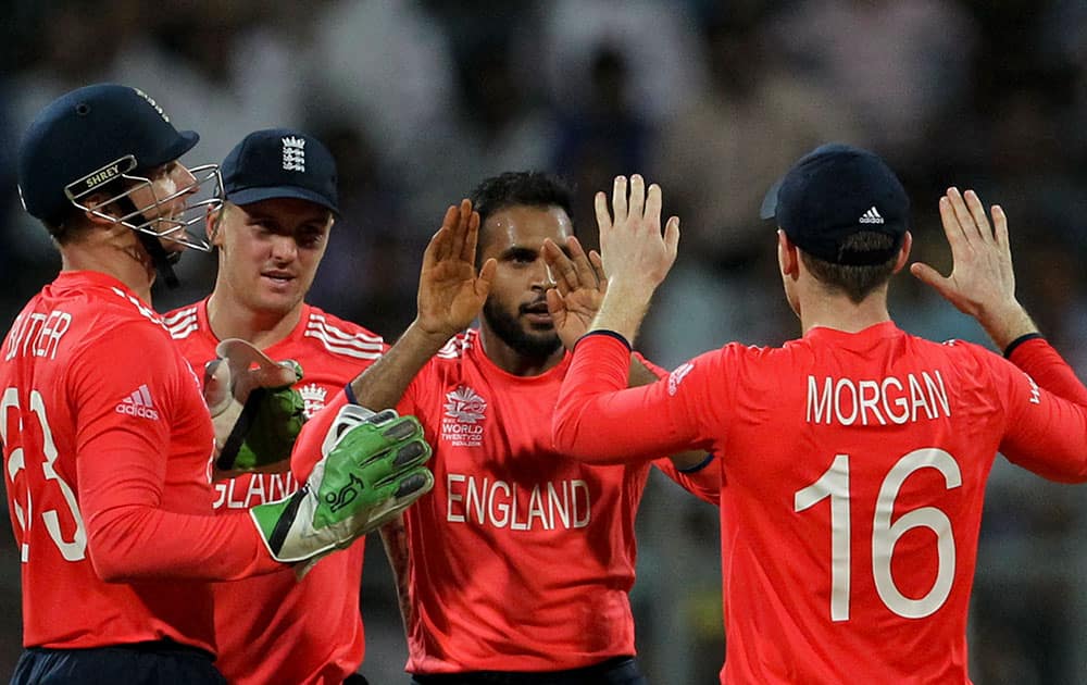 England players celebrate the wicket of West Indies’ Marlon Samuels, during their ICC World Twenty20 2016 cricket match at the Wankhede stadium in Mumbai.